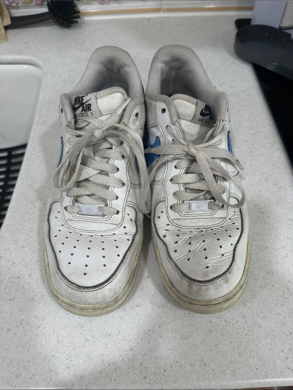 Nike Air Force White Sneakers with Blue Swoosh